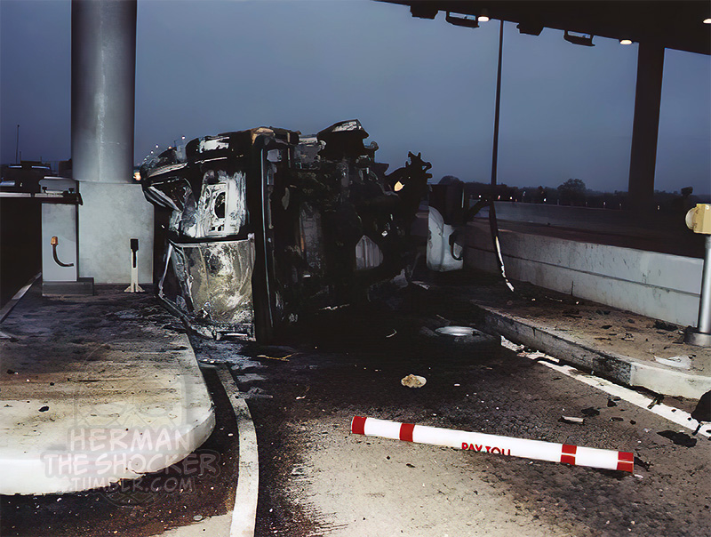 A van crashed into a toll booth and burst into flames
