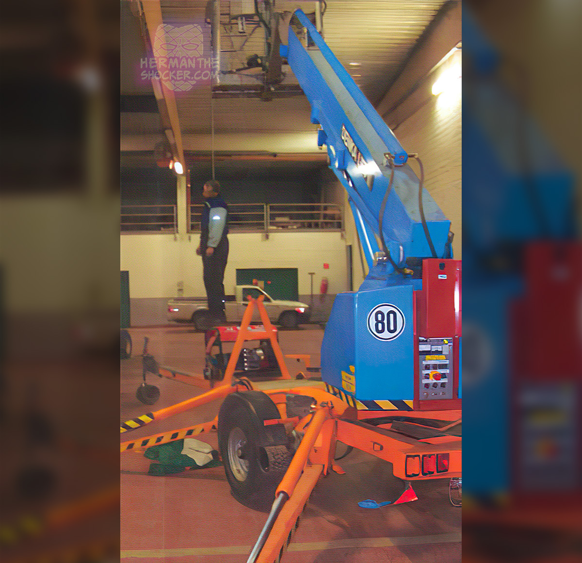 Man found hanging on the cage of an elevating work platform