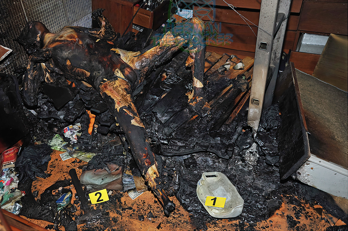 A burned body found on an “altar” made of banknotes